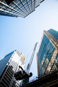 Sydney city office buildings with crane, from below