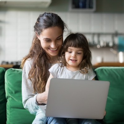 Mum and daughter looking at laptop